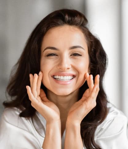 Woman with a bright white smile after professional teeth whitening