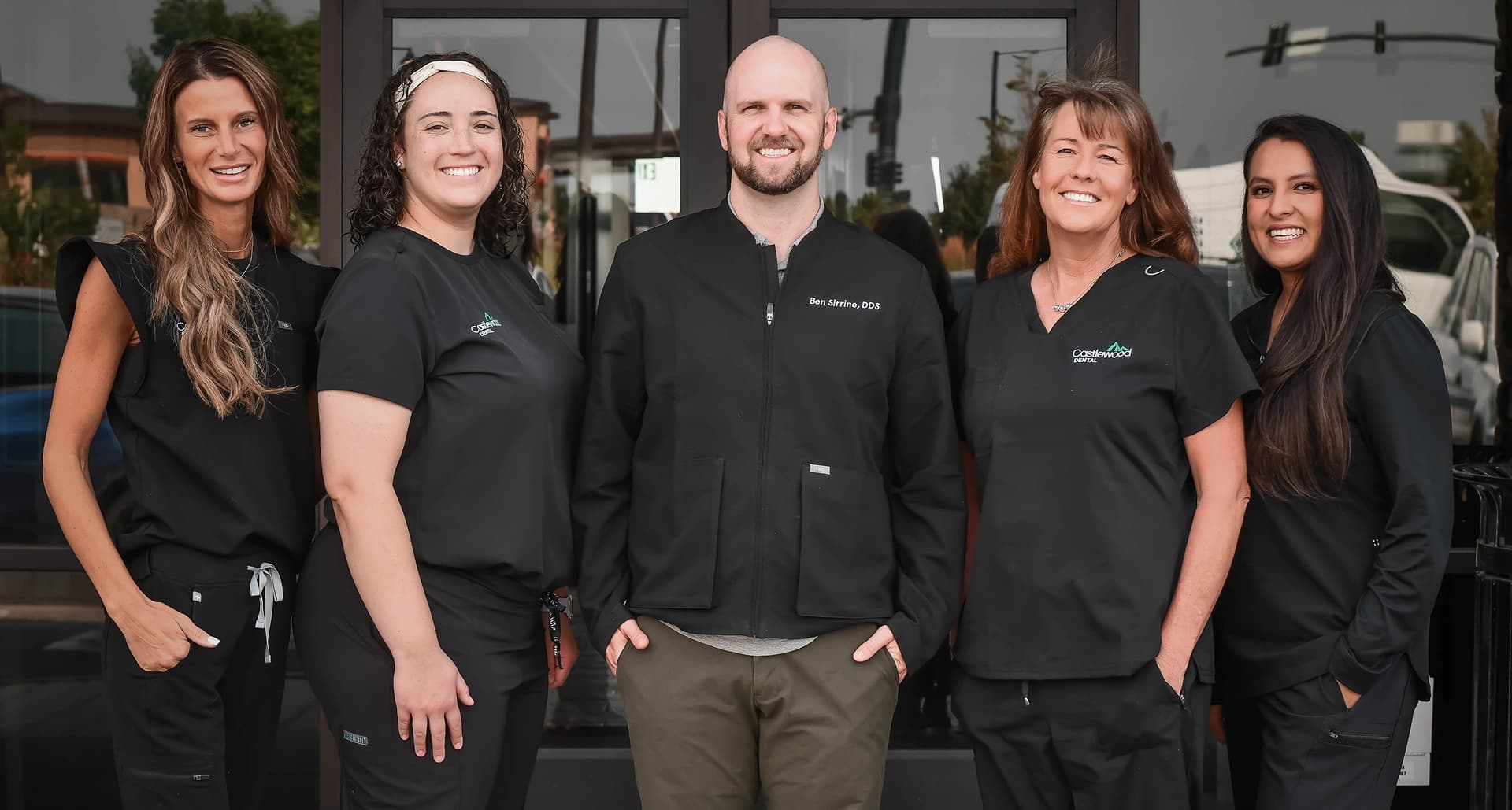 Dr. Ben Sirrine and the Castlewood Dental team standing outside the dental office in Parker, CO